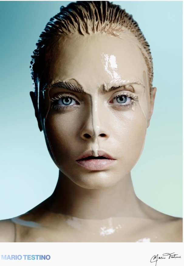 Photo of Cara Delevingne with paint dripping down her face