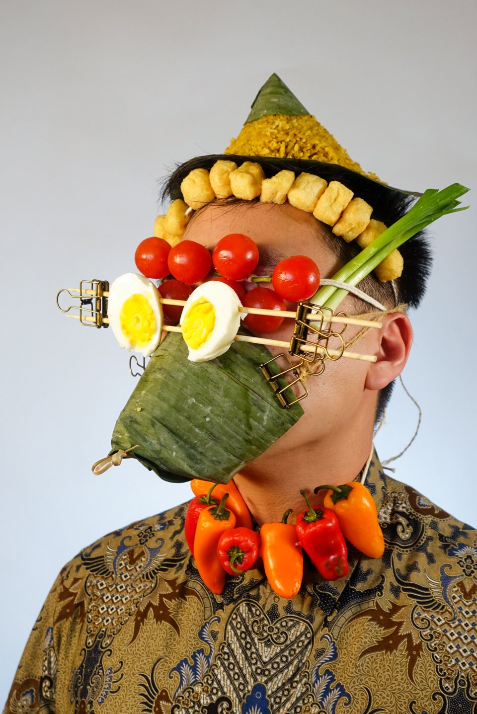 Photo of Foodmasku with one of his iconic food masks on