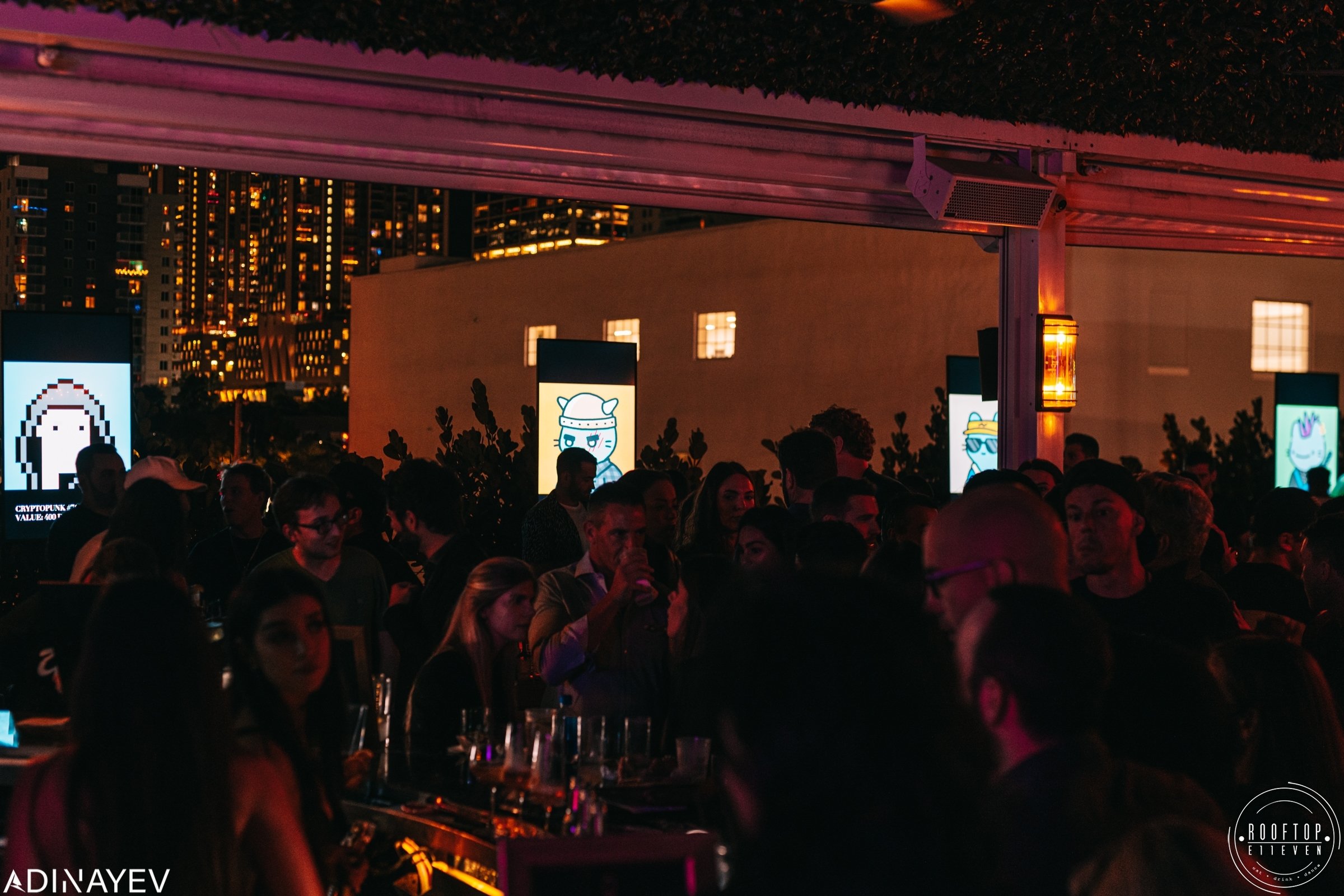A photograph from Miami Nightclub E11even on NFT Night featuring a Bored Ape auction