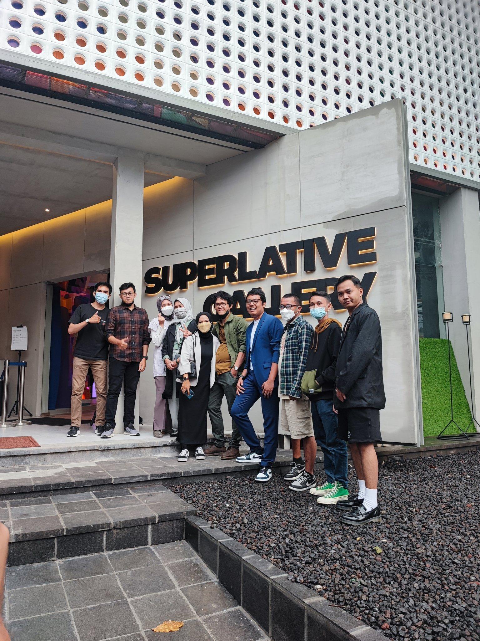 image of Superlative Secret Society creators outside Superlative NFT gallery