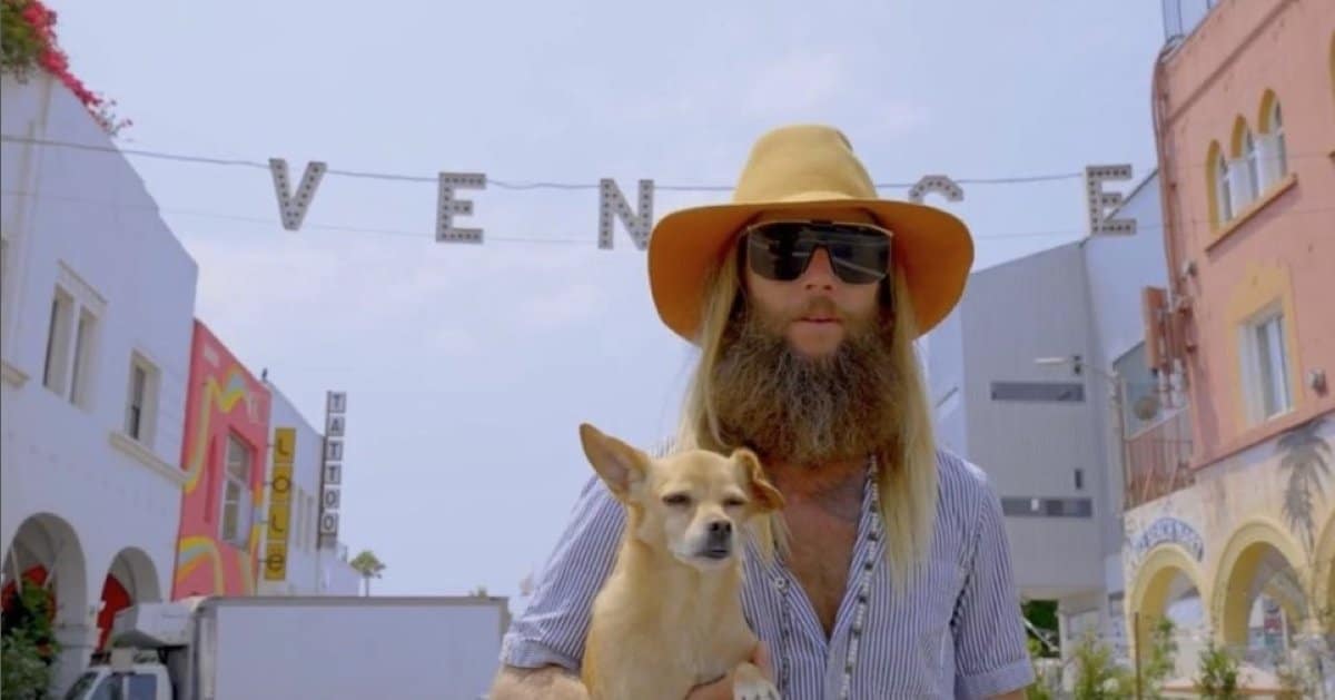 NFTV co founder Greg Cipes standing in front of the Venice Beach sign