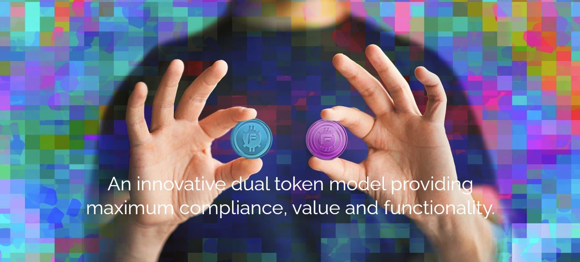 a man holding up two tokens representing the two film.io tokens