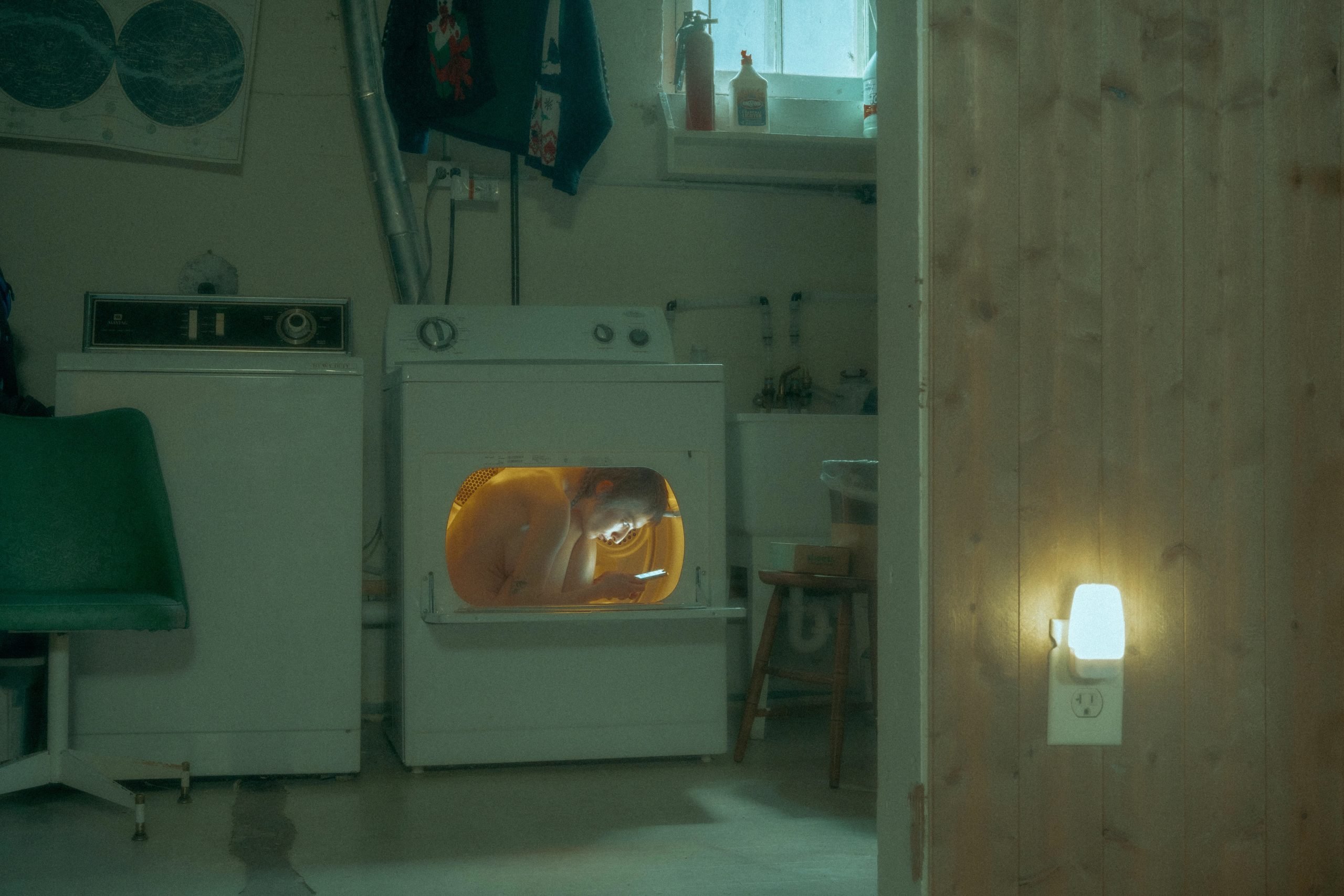 photograph by Summer Wagner of a woman sitting inside a washer